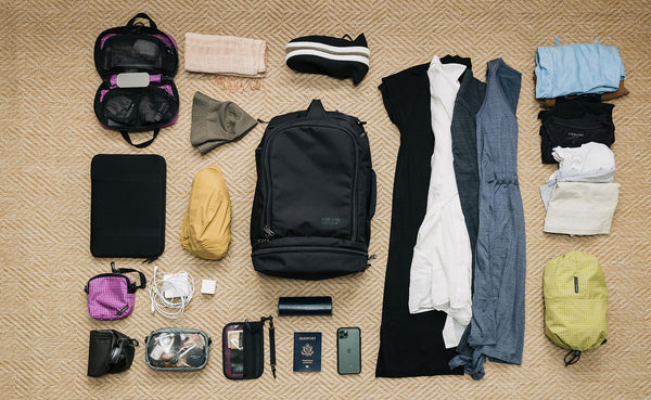 A possible load out of the Techonaut 30, including clothes, shoes, toiletry kit, phone, laptop, chargers, and headphones.